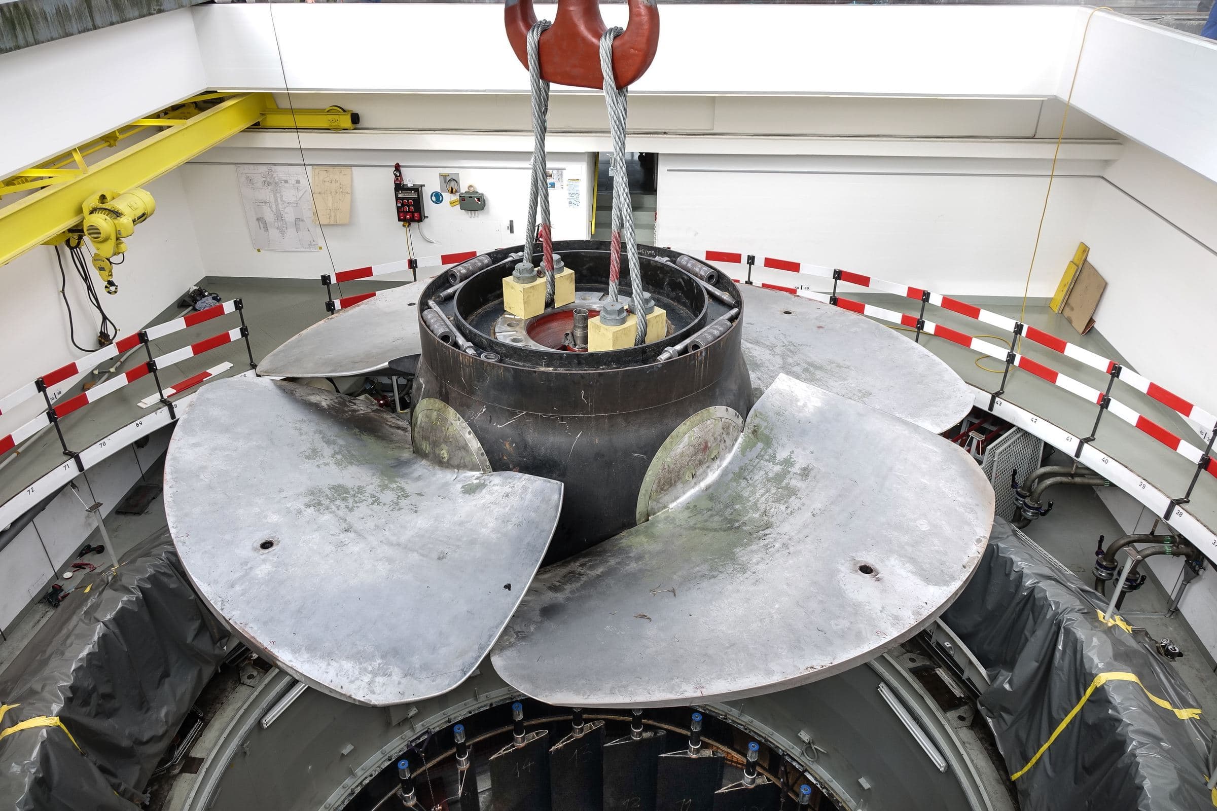 Kaplan — A 5.9 m, 64 t Kaplan runner being lowered into its pit under the powerhouse crane
